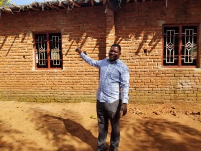 Benson in front of building